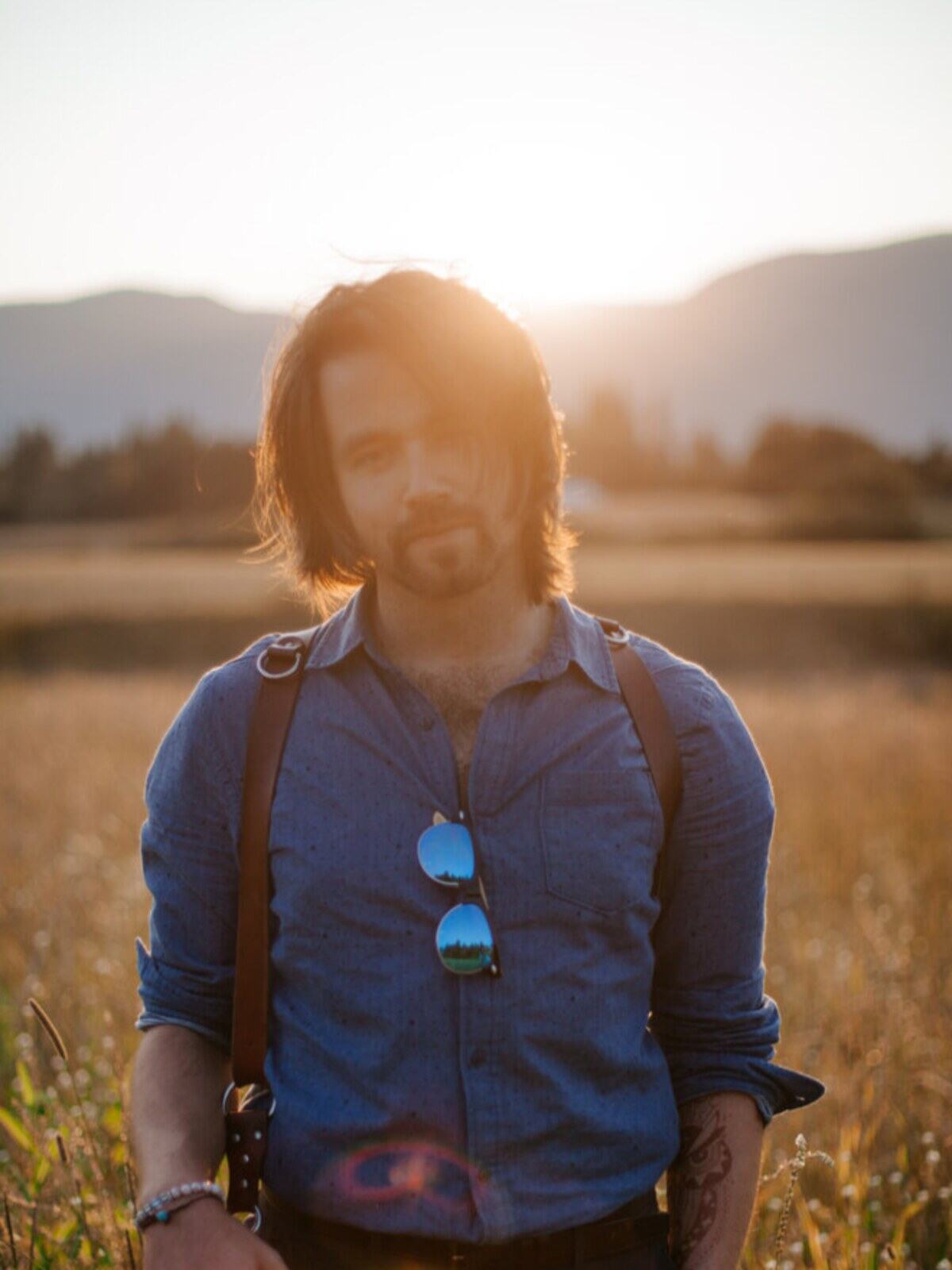 Photographer in warm field light