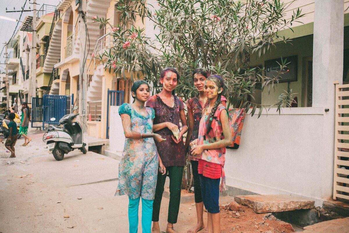 Holi celebration colour moves through the street in Mysore, India.