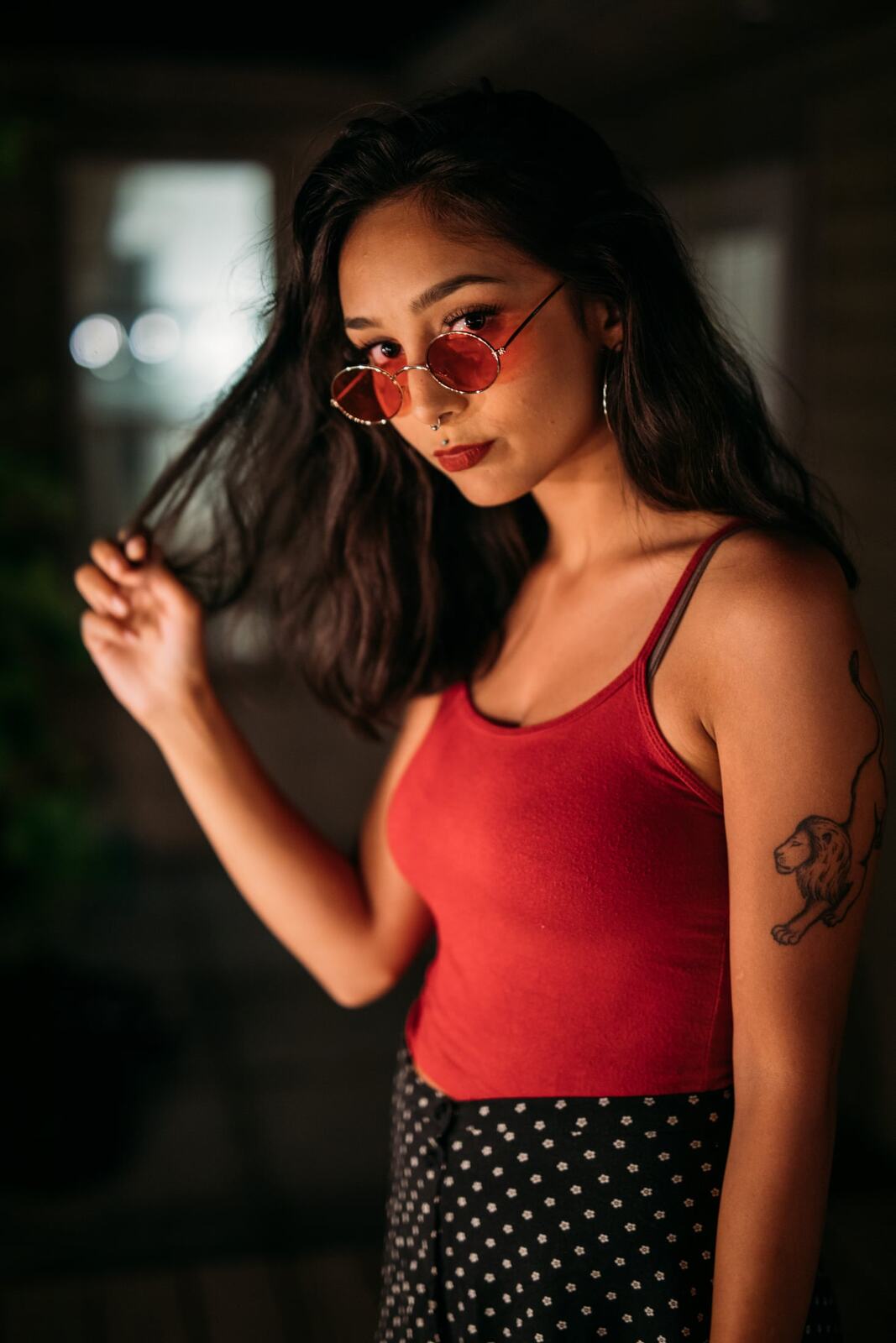 Angelica in Warm Shadow story frame 1: Red sunglasses, warm rooms, deck lights and close portraits from a more intimate portrait session.