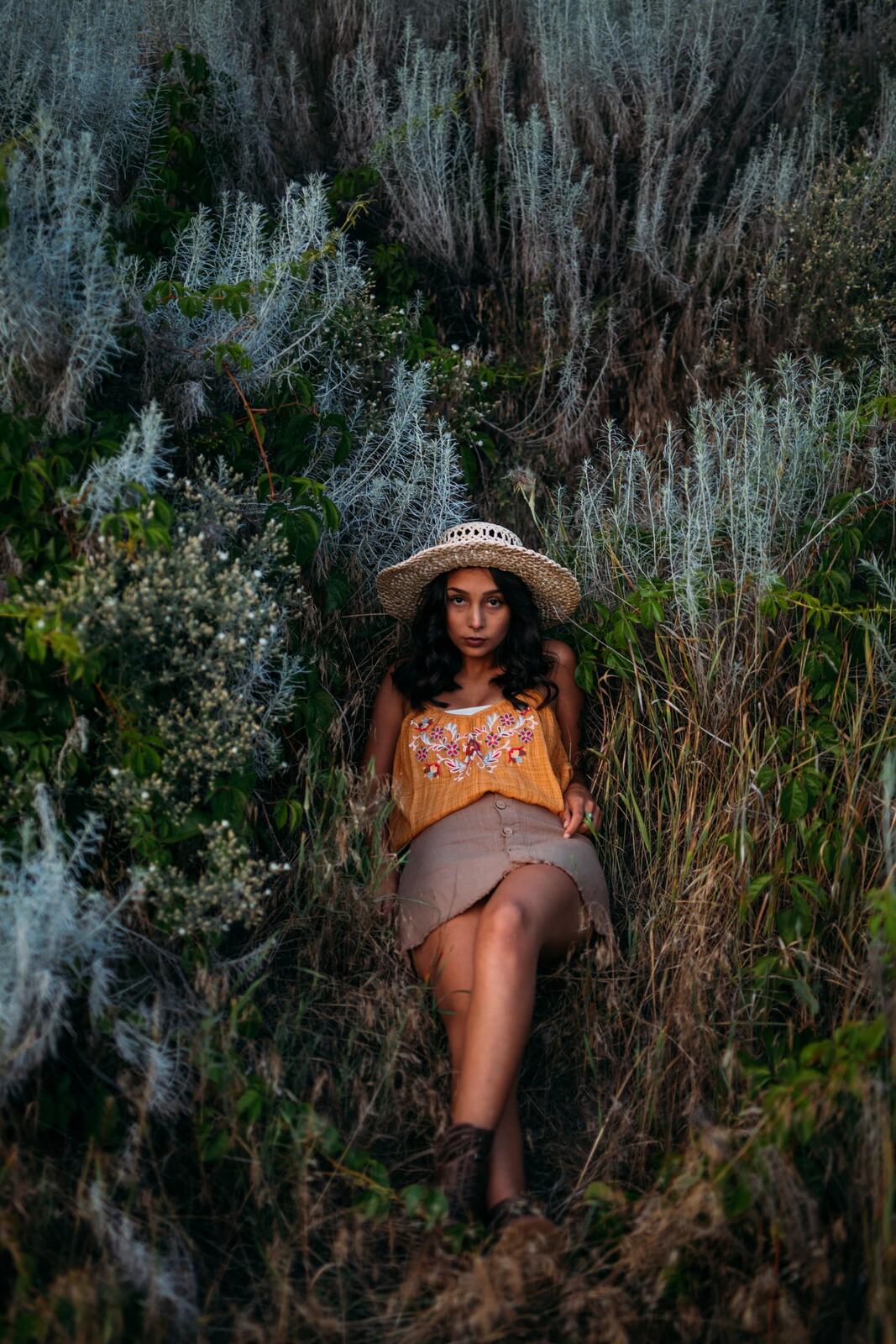 Angelica in Garden Light story frame 19: Mirror play, garden colour, straw hat and reflective frames with a quieter kind of romance.