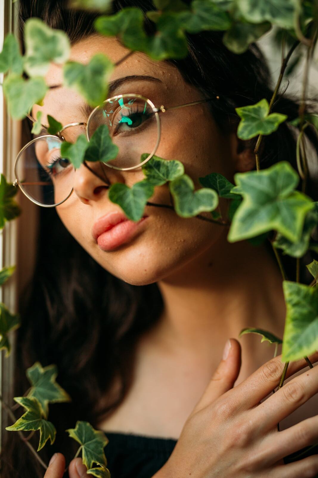 Mel in Reeds and Warm Dusk story frame 14: Bubbles, lake edge, reeds, glasses and dusk colour from a playful portrait story.