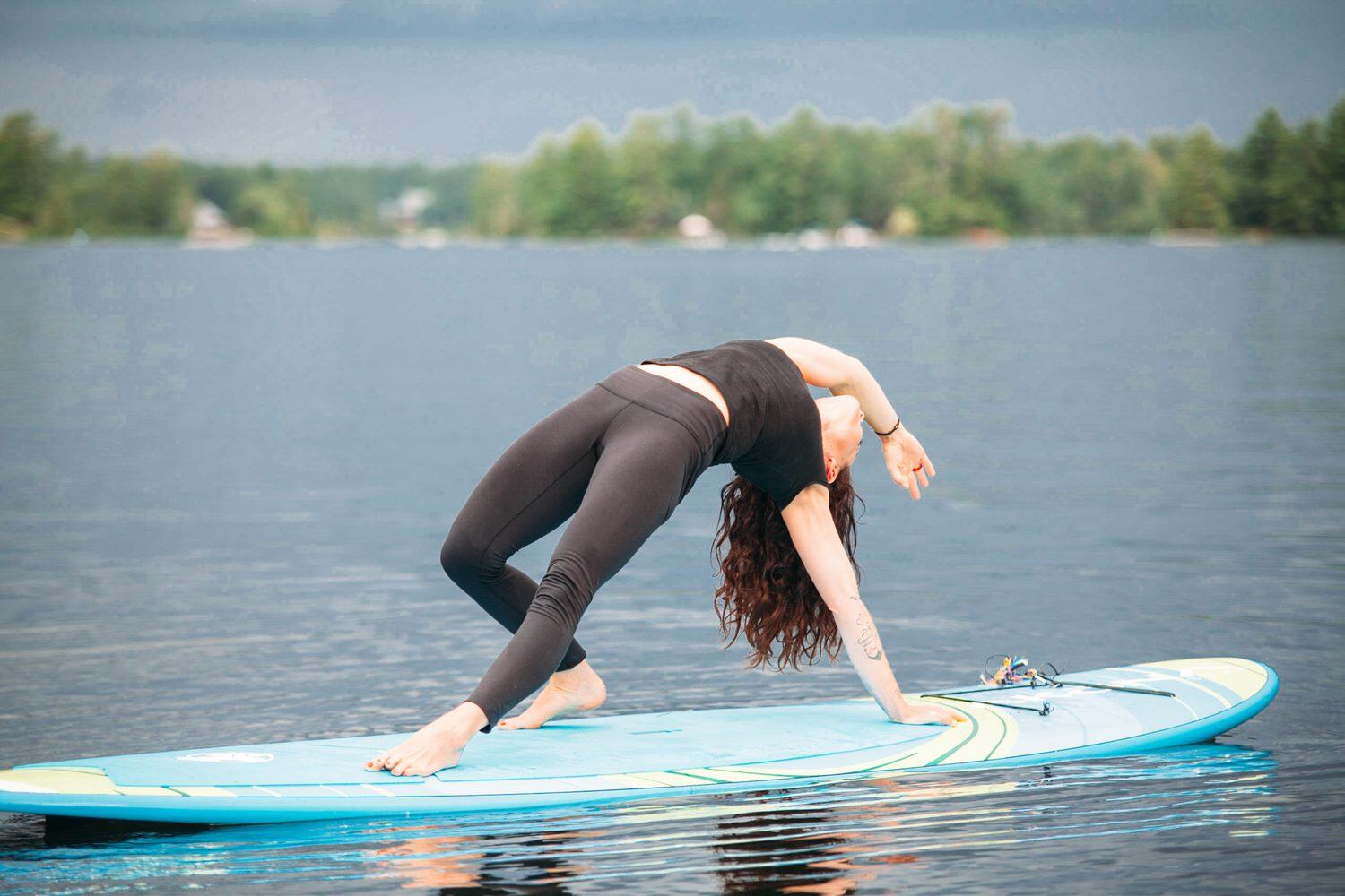 Ash and Jill, SUP Yoga corporate story frame 5: Corporate lifestyle photography for Ash and Jill on stand-up paddleboards, with yoga movement, instructor portraits and lake-based imagery for a wellness business.