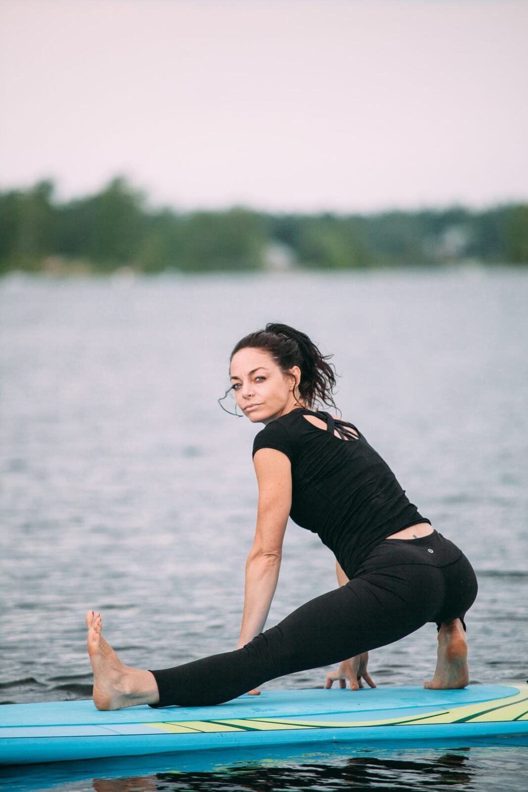 Ash and Jill, SUP Yoga corporate story frame 12: Corporate lifestyle photography for Ash and Jill on stand-up paddleboards, with yoga movement, instructor portraits and lake-based imagery for a wellness business.