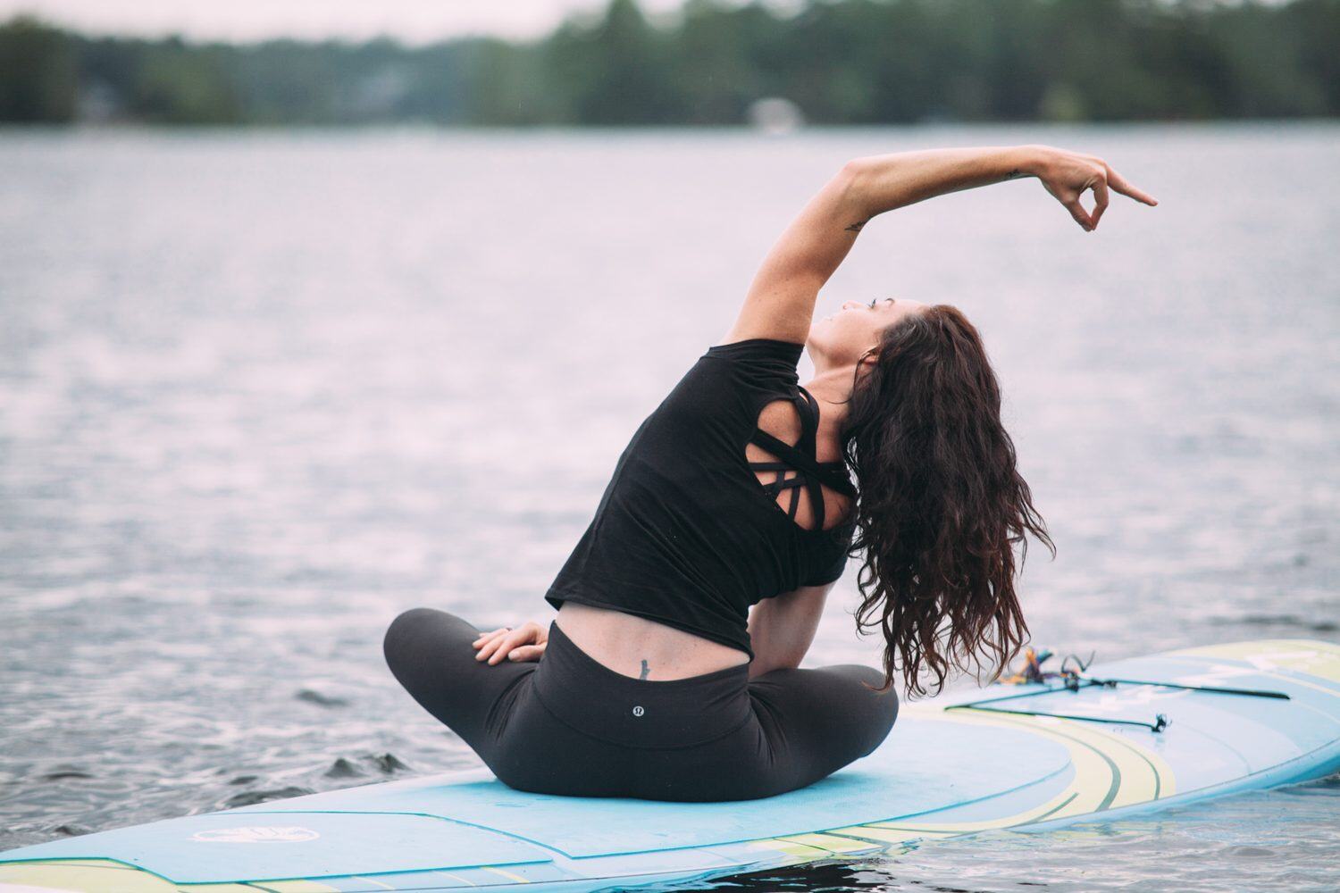 Ash and Jill, SUP Yoga corporate story frame 21: Corporate lifestyle photography for Ash and Jill on stand-up paddleboards, with yoga movement, instructor portraits and lake-based imagery for a wellness business.