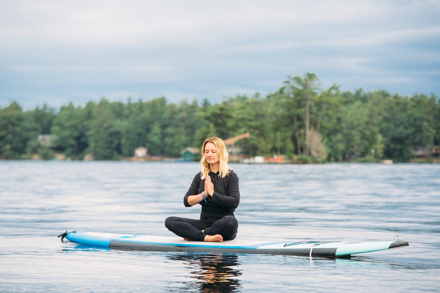 Ash and Jill, SUP Yoga corporate story frame 32: Corporate lifestyle photography for Ash and Jill on stand-up paddleboards, with yoga movement, instructor portraits and lake-based imagery for a wellness business.