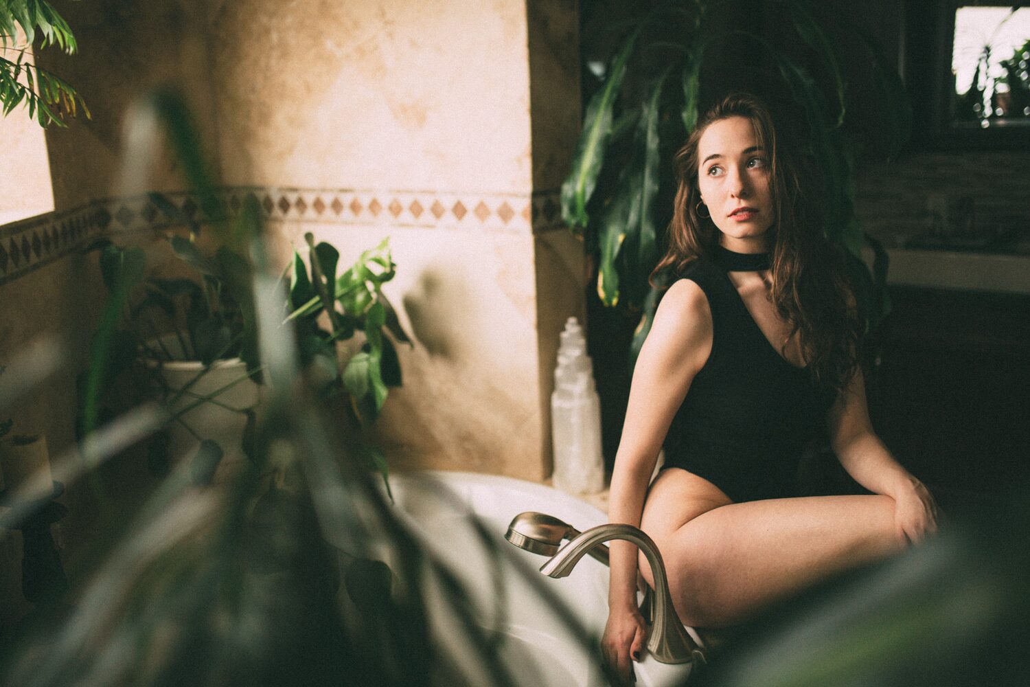 Bailey in Kelowna portraits story frame 31: Two portrait sessions moving through window light, body line, bold colour, foliage and floral-bath portraits.