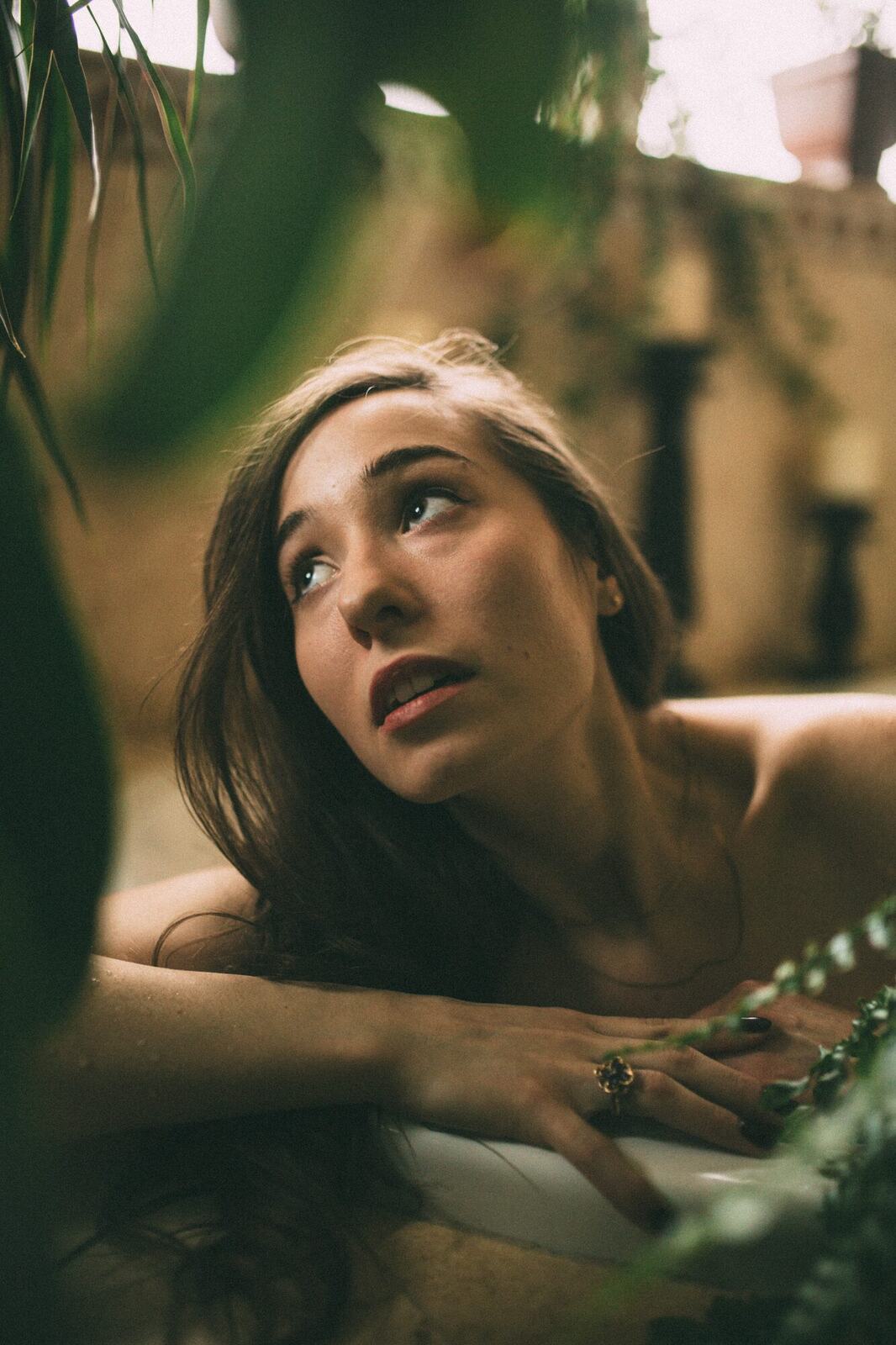 Bailey in Kelowna portraits story frame 34: Two portrait sessions moving through window light, body line, bold colour, foliage and floral-bath portraits.