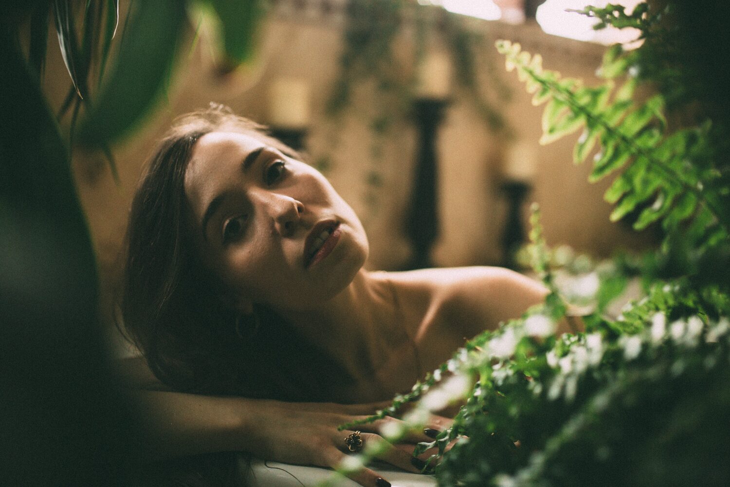 Bailey in Kelowna portraits story frame 35: Two portrait sessions moving through window light, body line, bold colour, foliage and floral-bath portraits.