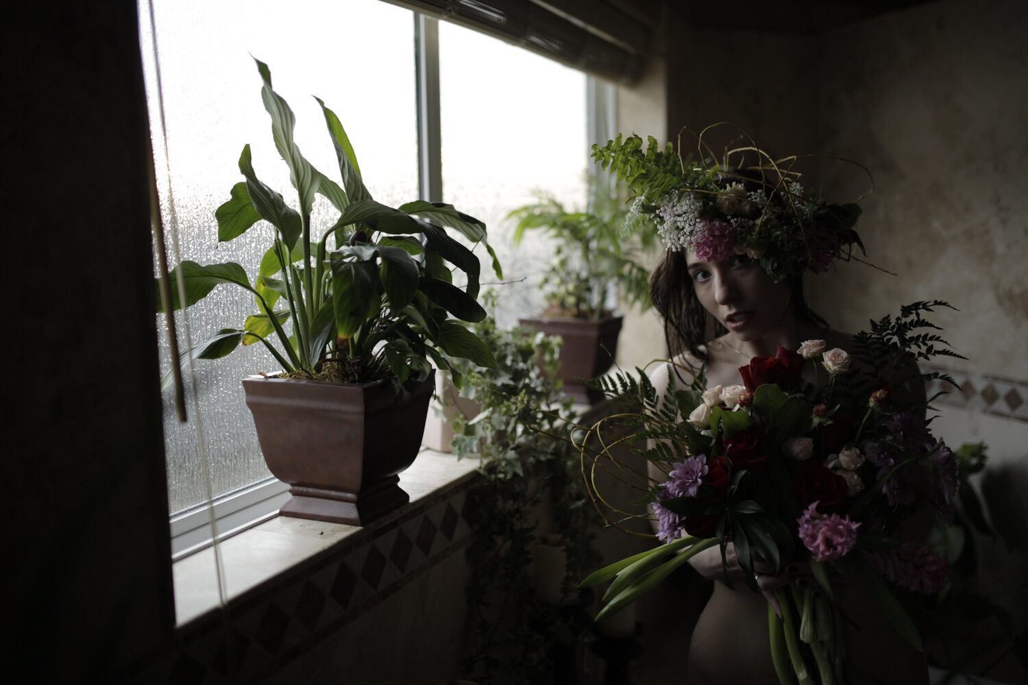 Bailey in Kelowna portraits story frame 41: Two portrait sessions moving through window light, body line, bold colour, foliage and floral-bath portraits.