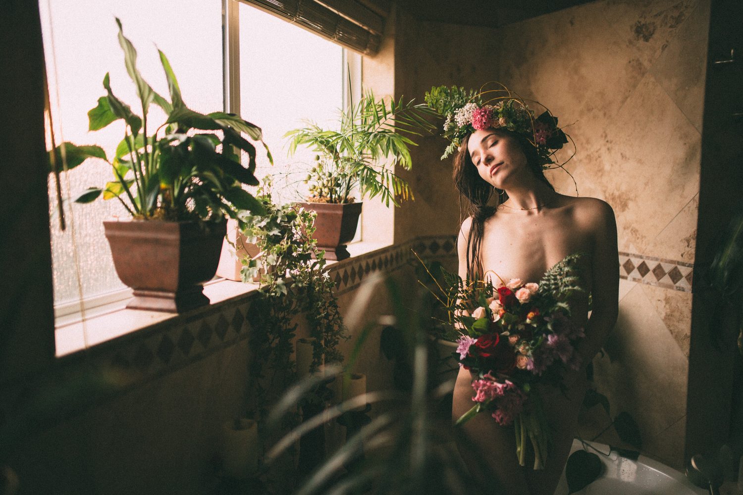Bailey in Kelowna portraits story frame 45: Two portrait sessions moving through window light, body line, bold colour, foliage and floral-bath portraits.
