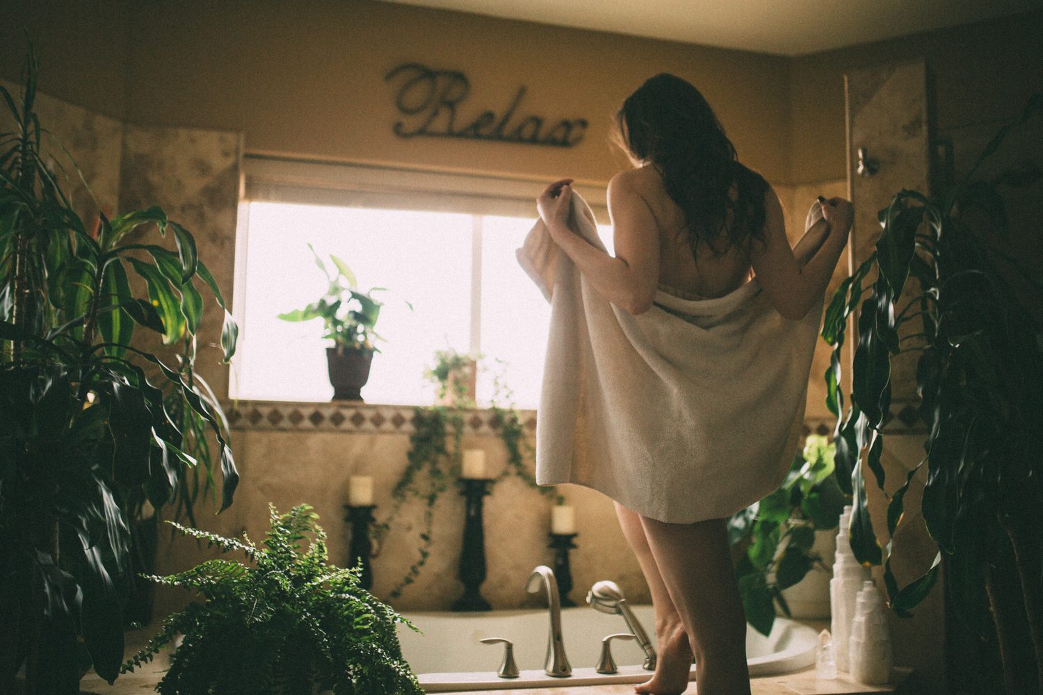 Bailey in Kelowna portraits story frame 32: Two portrait sessions moving through window light, body line, bold colour, foliage and floral-bath portraits.