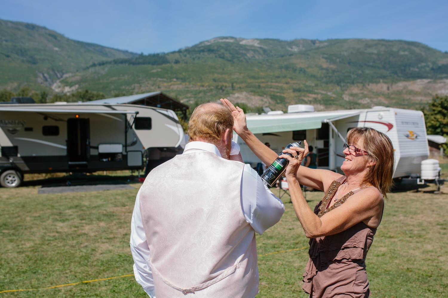Barbara and Ryan weddings story frame 3: A Salmon Arm wedding near Mount Ida, moving from a private yard to Marine Peace Park and wharf portraits, with the groom's trucking life part of the story..