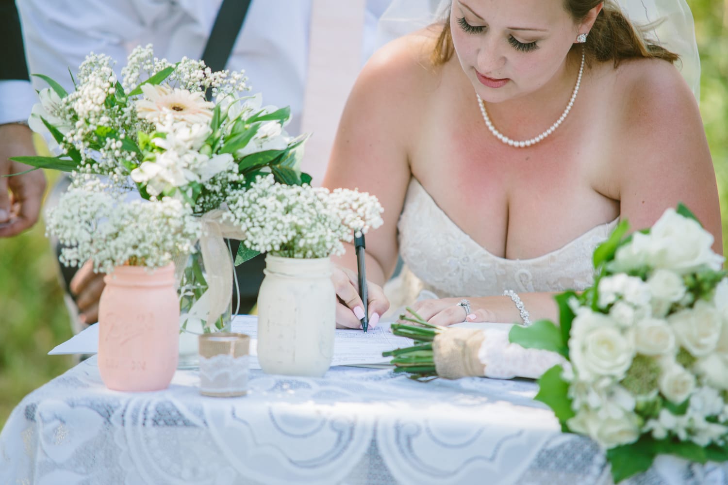Barbara and Ryan weddings story frame 17: A Salmon Arm wedding near Mount Ida, moving from a private yard to Marine Peace Park and wharf portraits, with the groom's trucking life part of the story..