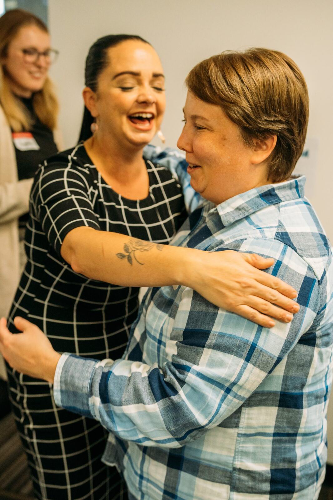 BrainTrust Canada Grand Opening corporate story frame 21: Event photography for BrainTrust Canada's Kelowna grand opening, with ribbon cutting, guests, office details, local food and exterior images for community and nonprofit communications..