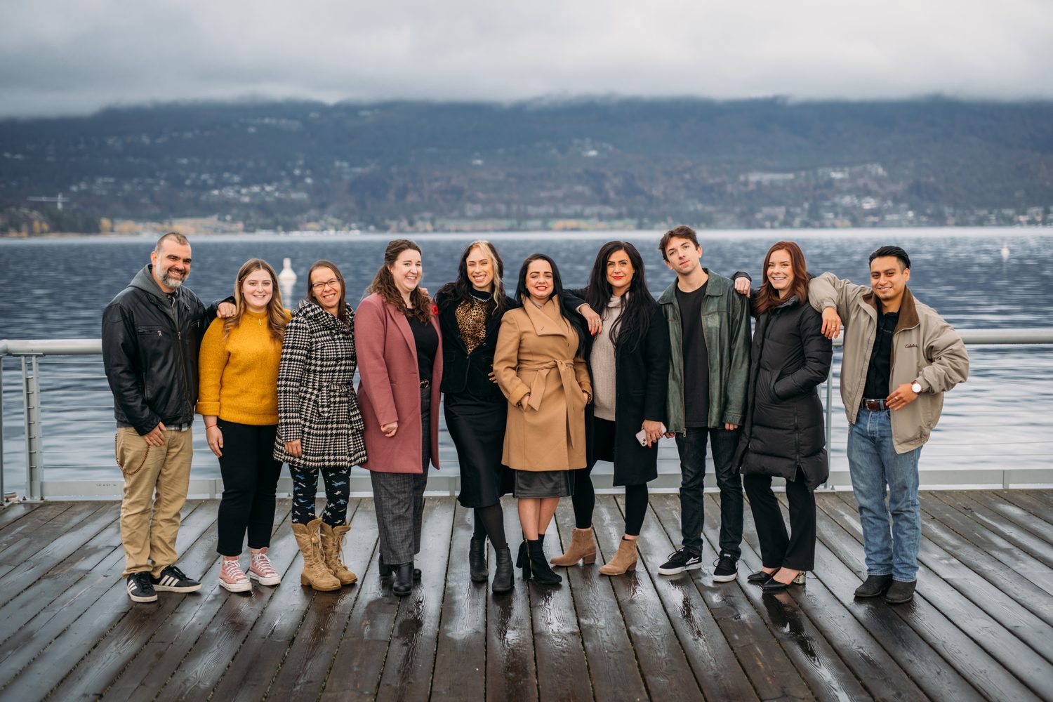 BrainTrust Canada Waterfront corporate story frame 10: Waterfront team and brand portraits for BrainTrust Canada in Kelowna, built around group photos, walking images and approachable nonprofit profile photography..