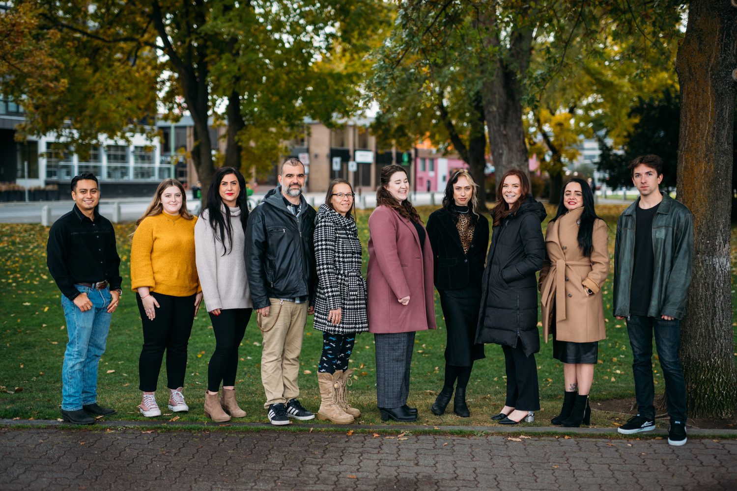 BrainTrust Canada Waterfront corporate story frame 26: Waterfront team and brand portraits for BrainTrust Canada in Kelowna, built around group photos, walking images and approachable nonprofit profile photography..