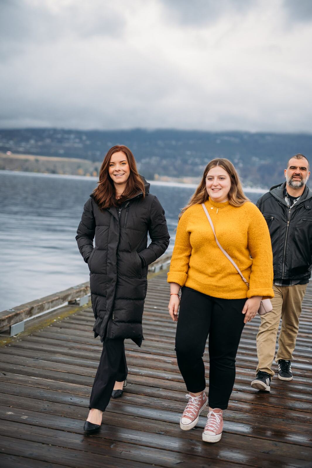 BrainTrust Canada Waterfront corporate story frame 22: Waterfront team and brand portraits for BrainTrust Canada in Kelowna, built around group photos, walking images and approachable nonprofit profile photography..