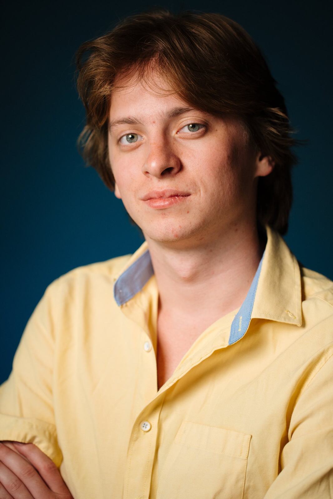 CATO Redux actor headshot on blue, photograph 2