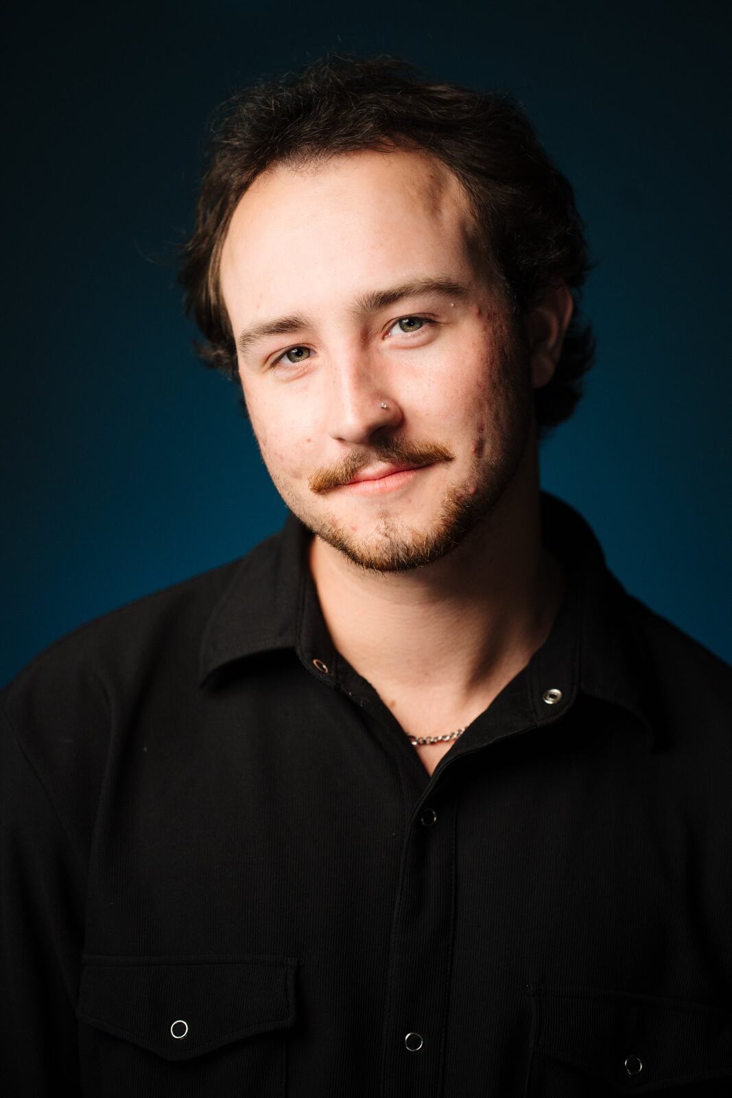 CATO Redux actor headshot on blue, photograph 20