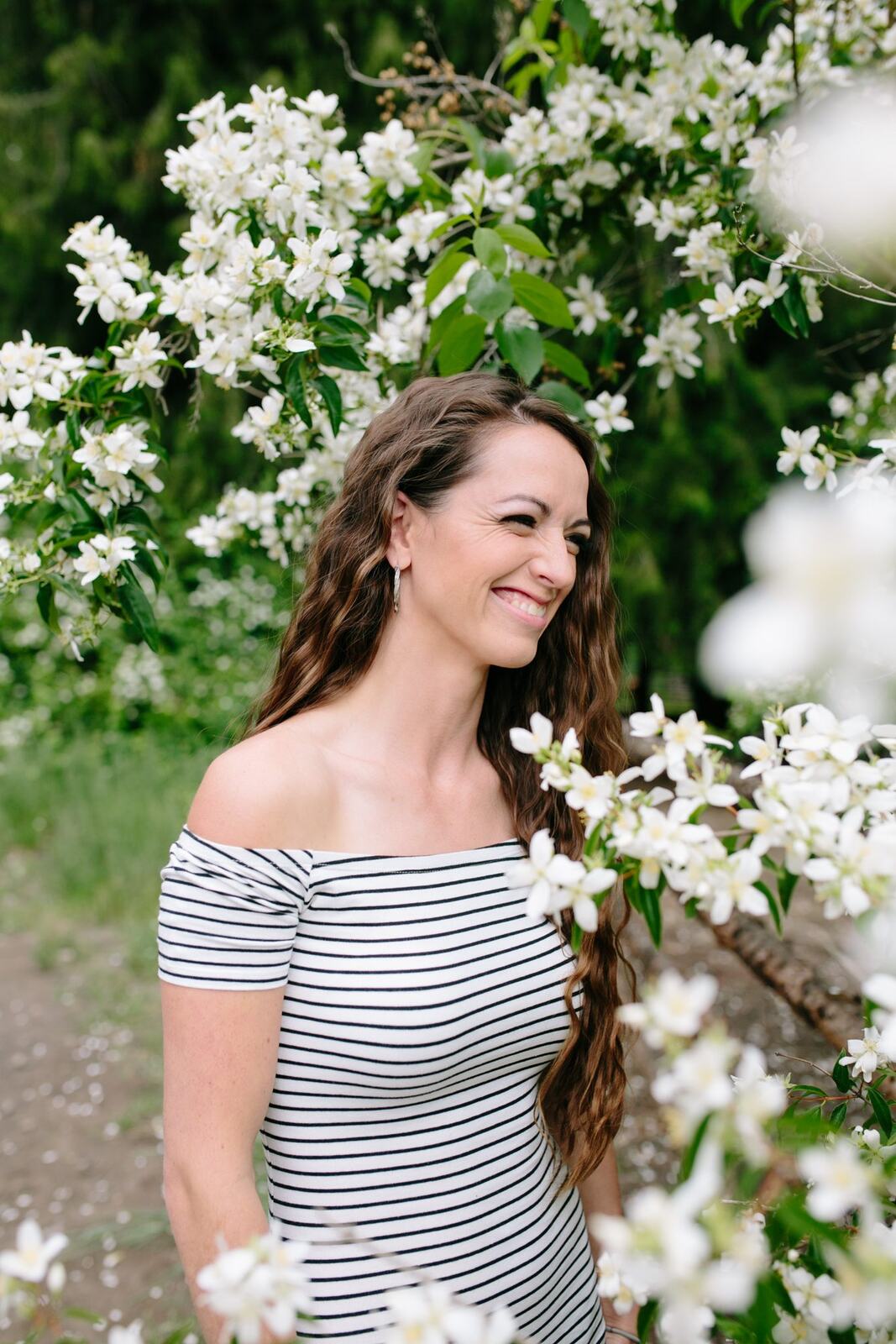 Charlotte, Rock the Dress portraits story frame 3: Charlotte Smith photographed for Rock the Dress near Salmon Arm, moving from blossoms and a yellow dress into creek, forest and horse portraits for the Canadian Cancer Society fundraiser.