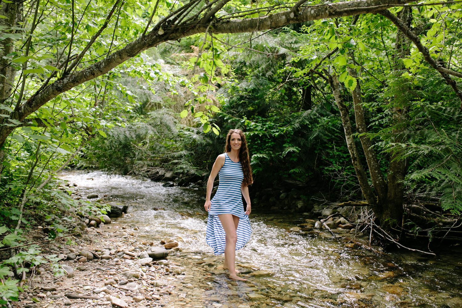 Charlotte, Rock the Dress portraits story frame 13: Charlotte Smith photographed for Rock the Dress near Salmon Arm, moving from blossoms and a yellow dress into creek, forest and horse portraits for the Canadian Cancer Society fundraiser.