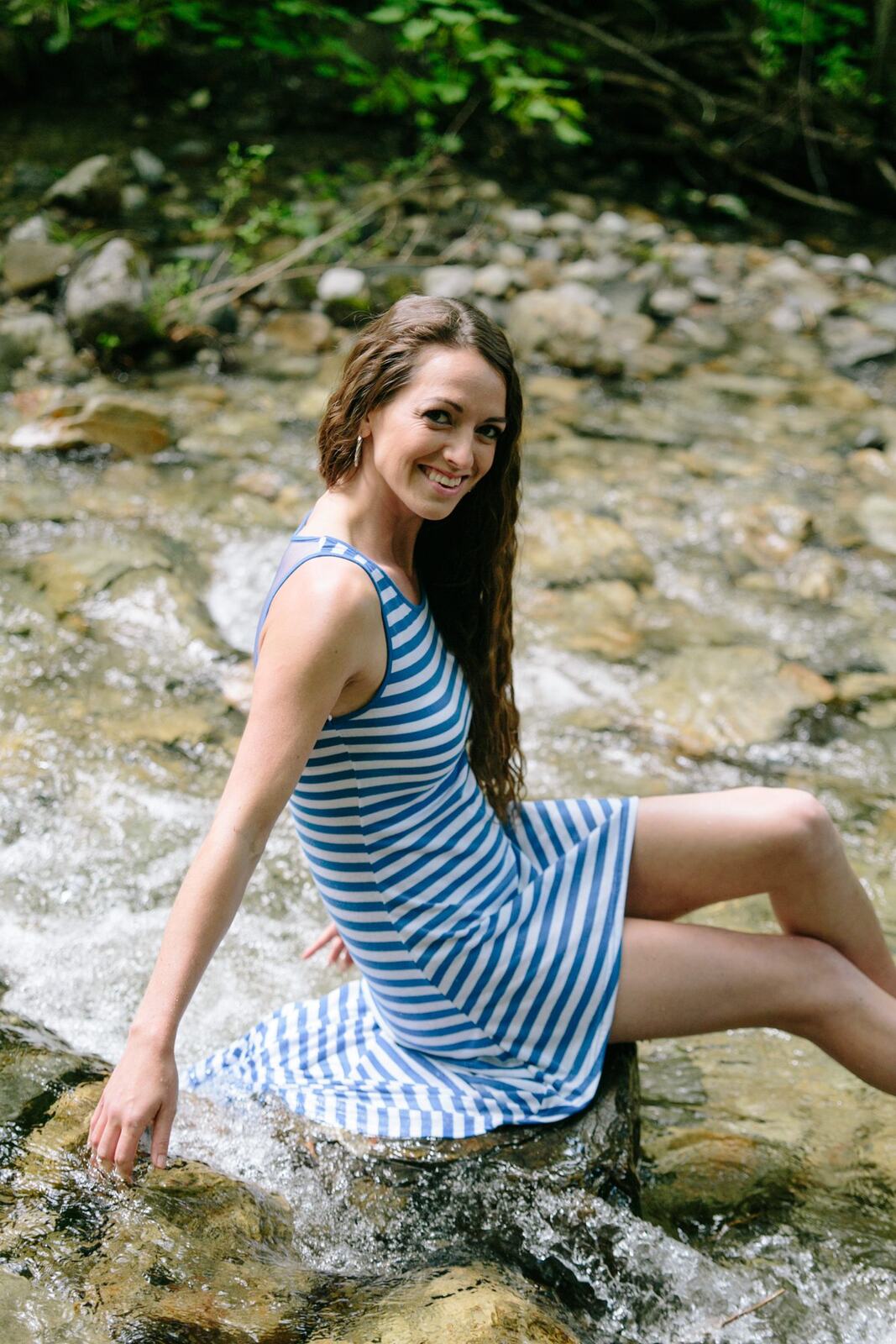Charlotte, Rock the Dress portraits story frame 14: Charlotte Smith photographed for Rock the Dress near Salmon Arm, moving from blossoms and a yellow dress into creek, forest and horse portraits for the Canadian Cancer Society fundraiser.