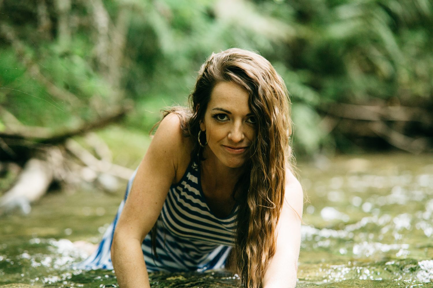 Charlotte, Rock the Dress portraits story frame 23: Charlotte Smith photographed for Rock the Dress near Salmon Arm, moving from blossoms and a yellow dress into creek, forest and horse portraits for the Canadian Cancer Society fundraiser.