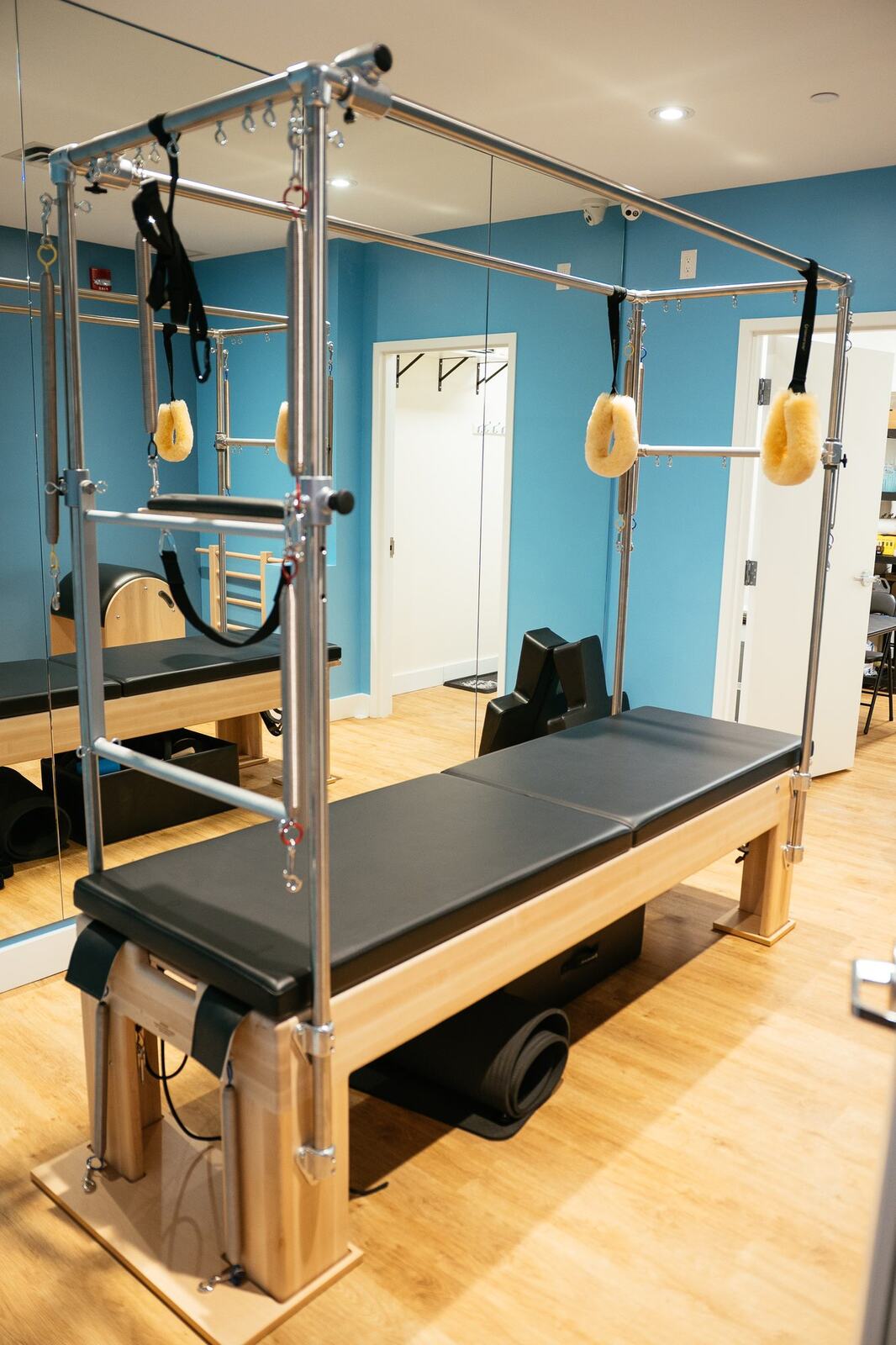 Club Pilates Barrhaven corporate story frame 13: Brand photography for Club Pilates Barrhaven in the Ottawa area, with studio interiors, staff portraits, private training rooms, equipment details and class movement for local marketing..