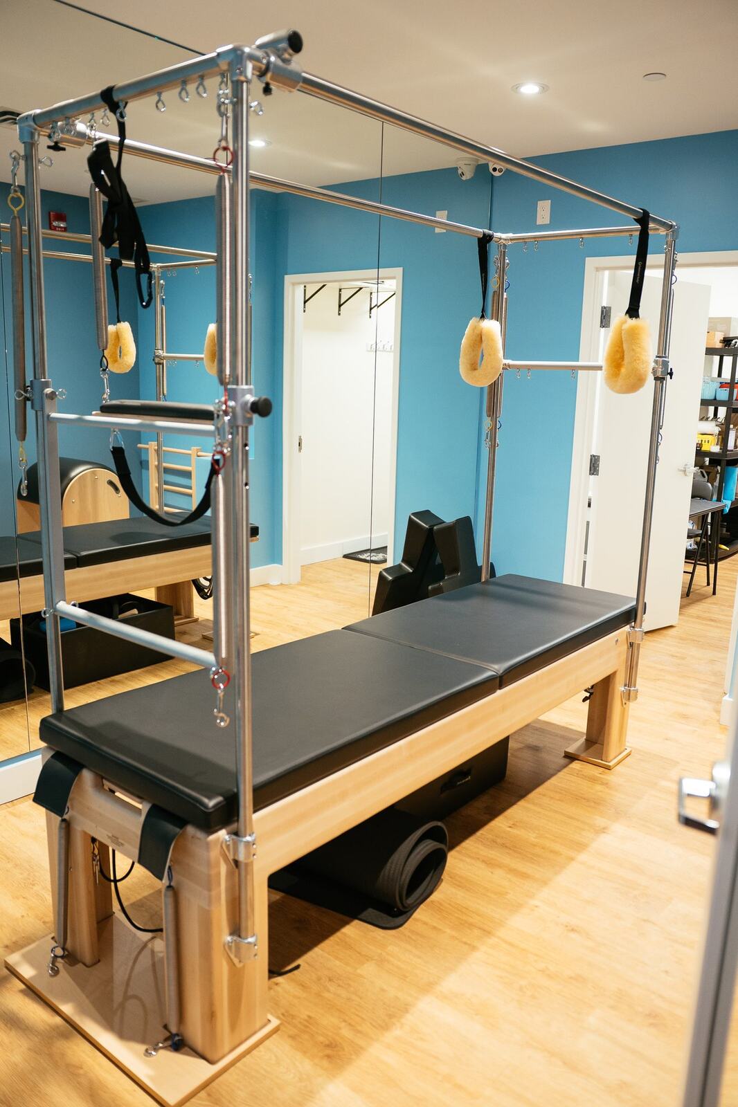 Club Pilates Barrhaven corporate story frame 14: Brand photography for Club Pilates Barrhaven in the Ottawa area, with studio interiors, staff portraits, private training rooms, equipment details and class movement for local marketing..