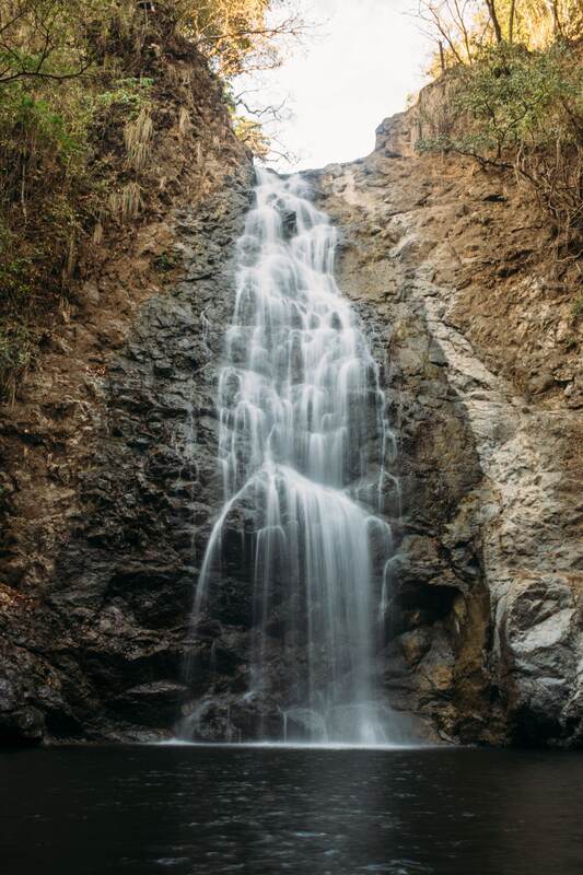 Costa Rica Afterglow story frame 7: A small Costa Rica travel sequence with ocean dusk, palms, jungle paths, waterfall light and print-minded details.
