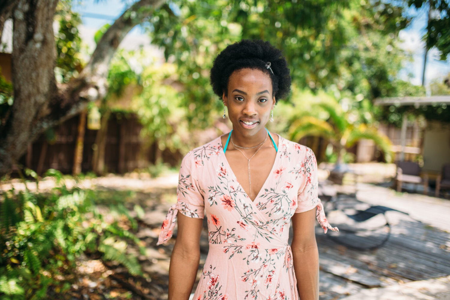 Dee-J in Miami portraits story frame 4: Two days with Dee-J in Miami, moving from a bright poolside portrait story to a second pool sequence and green-dress portraits along the riverbank.