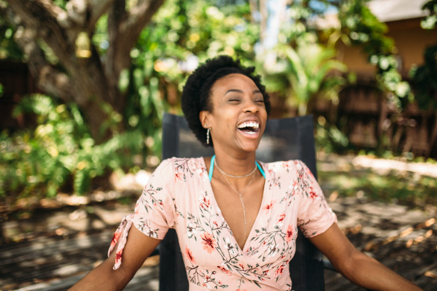 Dee-J in Miami portraits story frame 19: Two days with Dee-J in Miami, moving from a bright poolside portrait story to a second pool sequence and green-dress portraits along the riverbank.