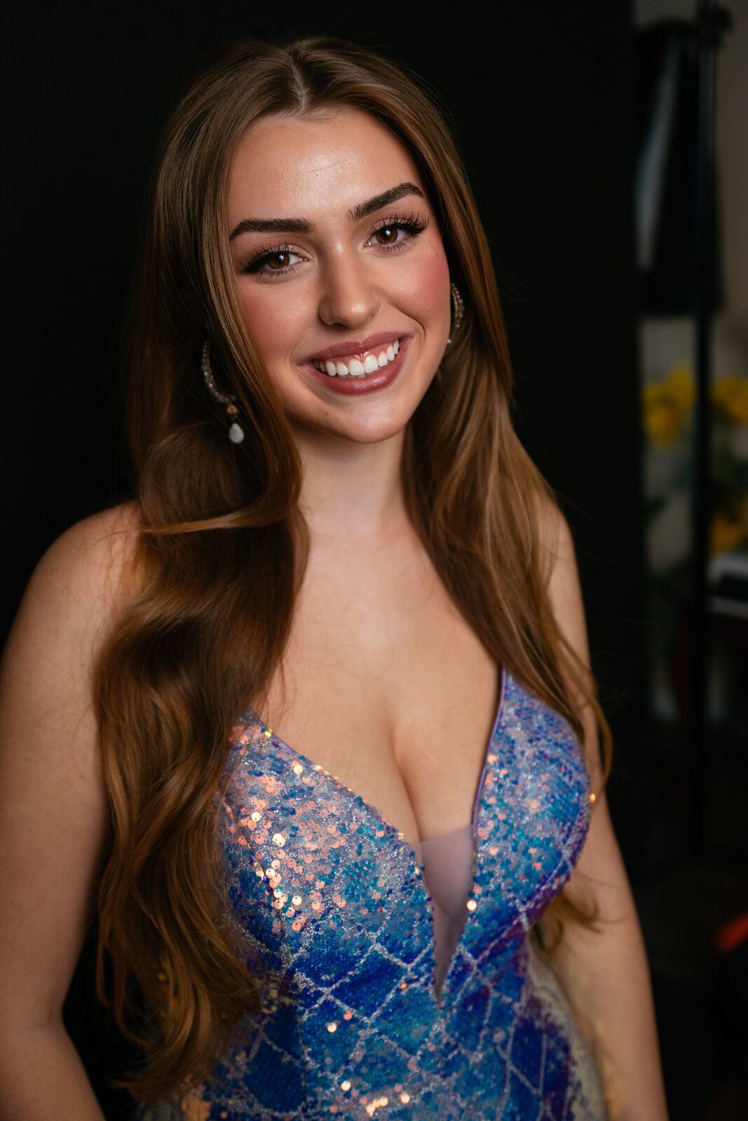 Bright studio headshot of Elena in wardrobe look 1