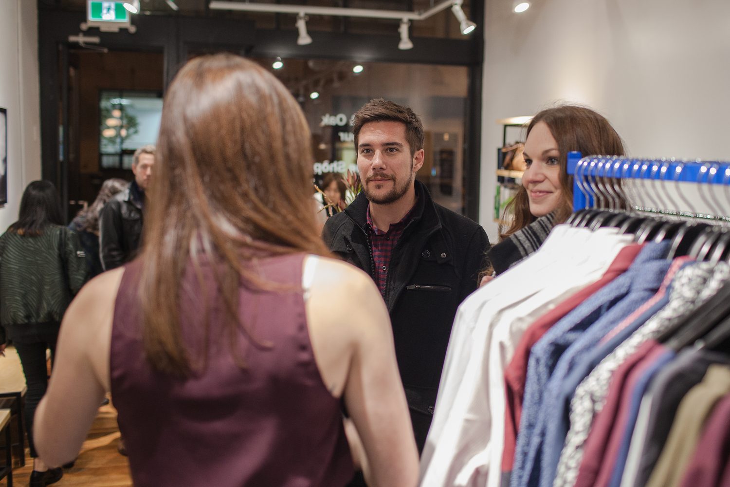 Frank & Oak Colour corporate story frame 12: Retail event photography for Frank & Oak Colour at The Blue Shop on Abbott Street in Vancouver, with the storefront, guests, clothing, details and the room in use.