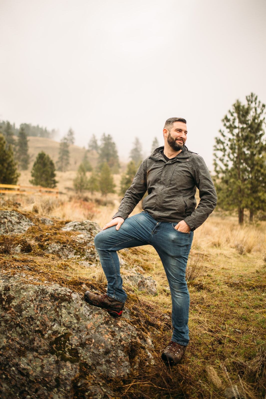 Jeremy standing in warm hillside light in a dark blazer for Optimize Organics.
