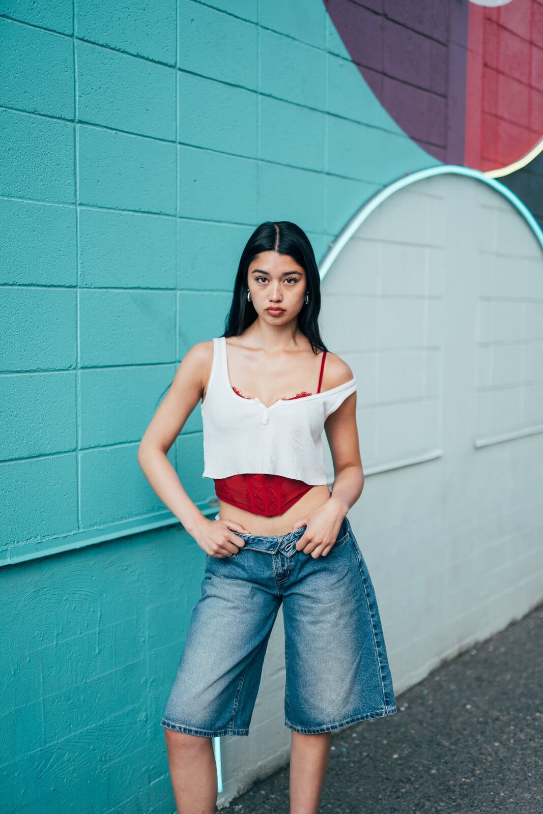 Julia in Kamloops portraits story frame 3: Colour walls, graffiti, black brick, red brick and a city walk with enough range to feel like a little editorial day.