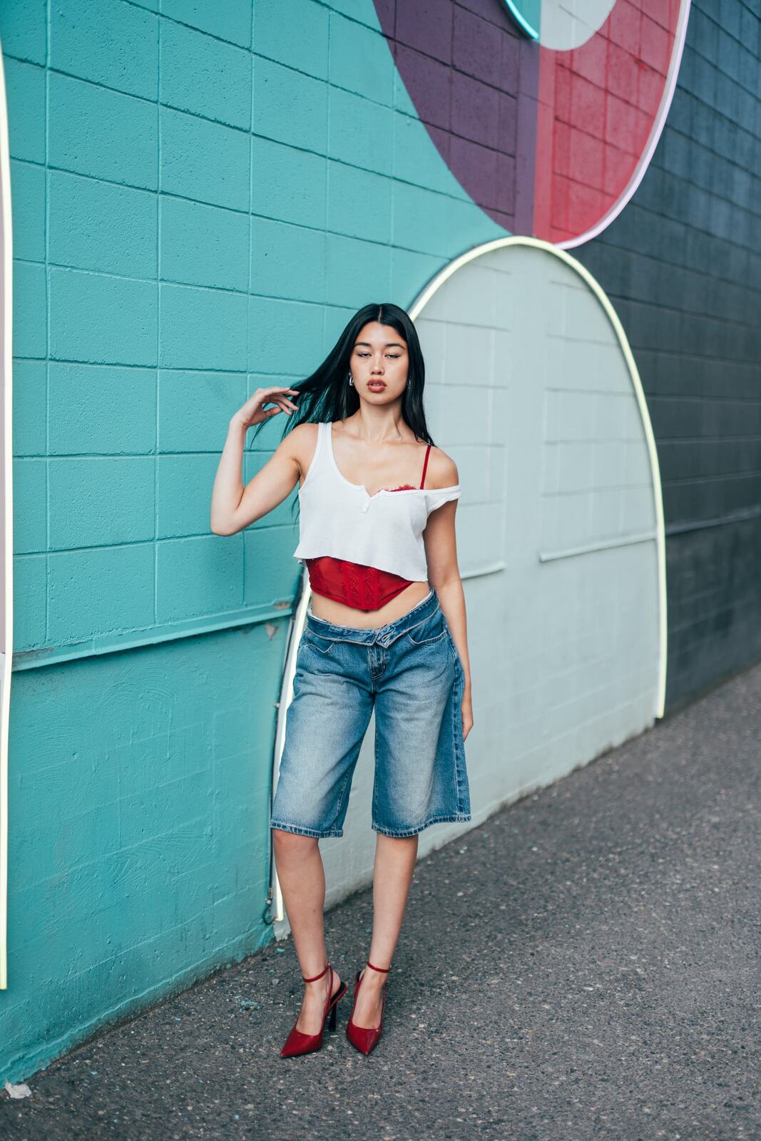 Julia in Kamloops portraits story frame 4: Colour walls, graffiti, black brick, red brick and a city walk with enough range to feel like a little editorial day.