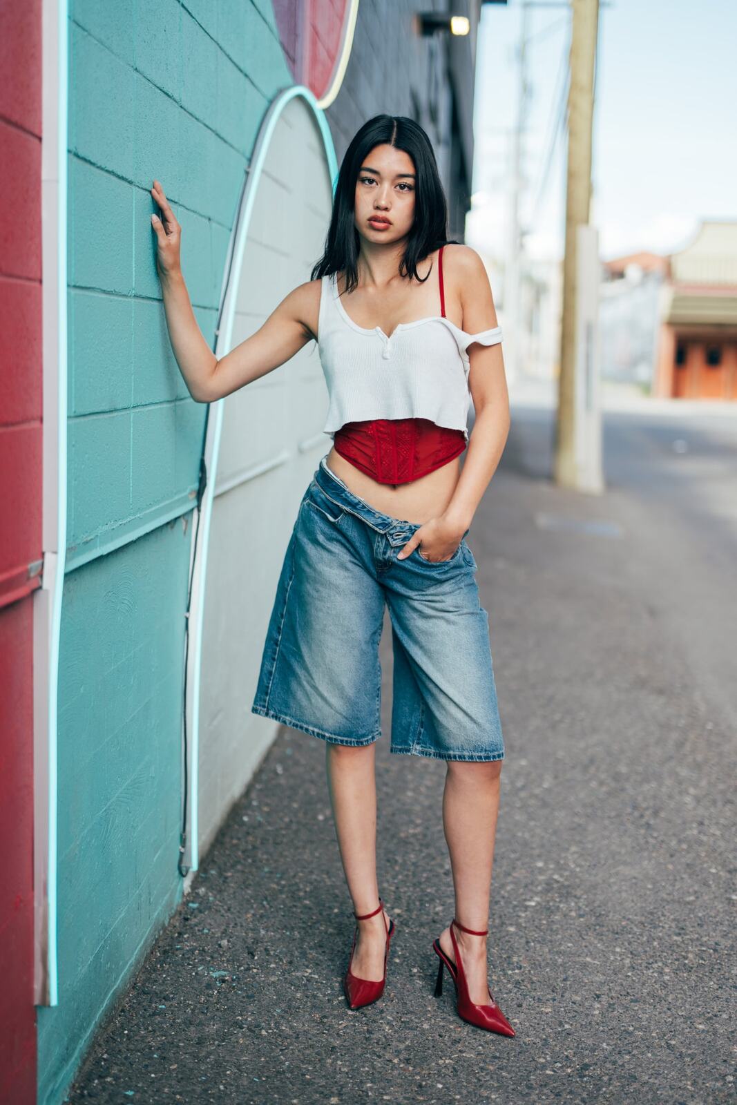 Julia in Kamloops portraits story frame 15: Colour walls, graffiti, black brick, red brick and a city walk with enough range to feel like a little editorial day.