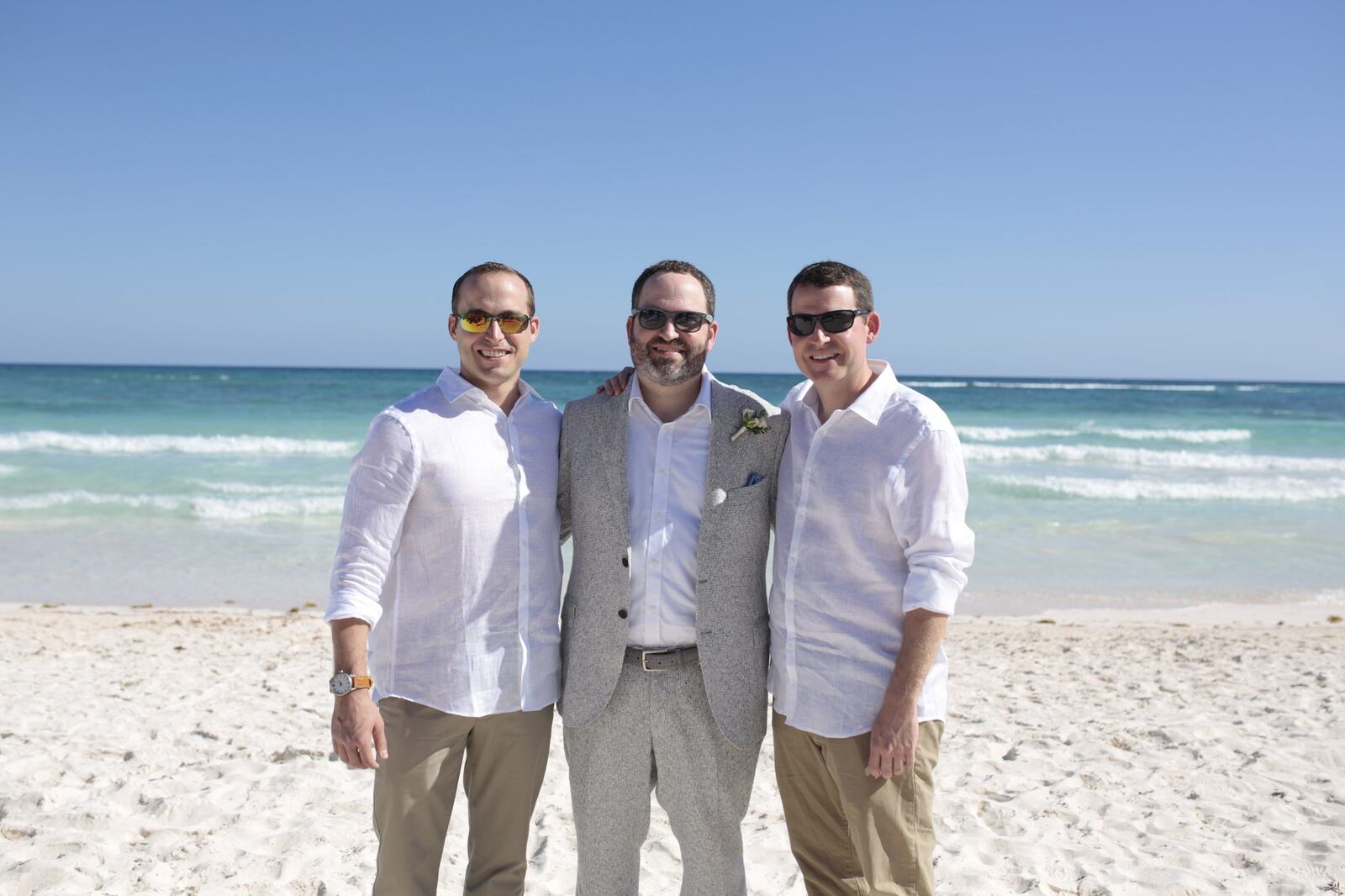 Ted and his groomsmen standing together on Xpu-Ha Beach