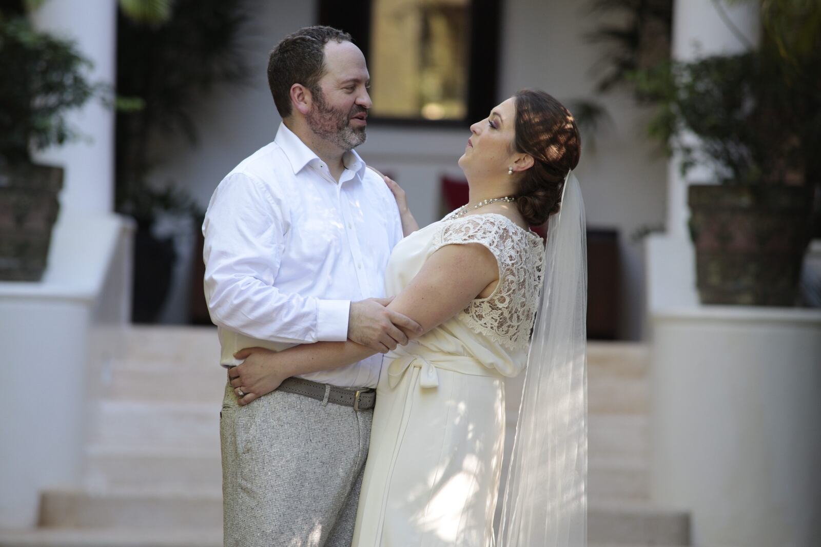 Kyra and Ted laughing together before the ceremony