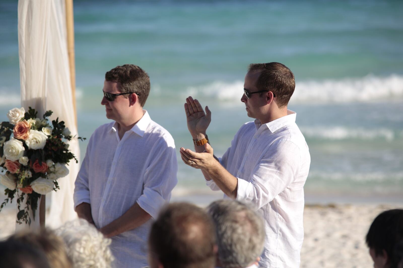 Friends reacting during the beach ceremony