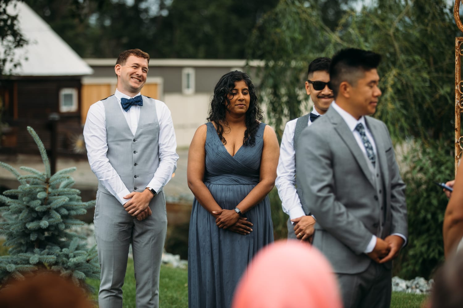 Leslie and Gerome weddings story frame 13: A Brook & Barn - Casorso Heritage Farm wedding in Kelowna, with orchard details, outbuildings, lawn games and a familiar friend-party feeling..