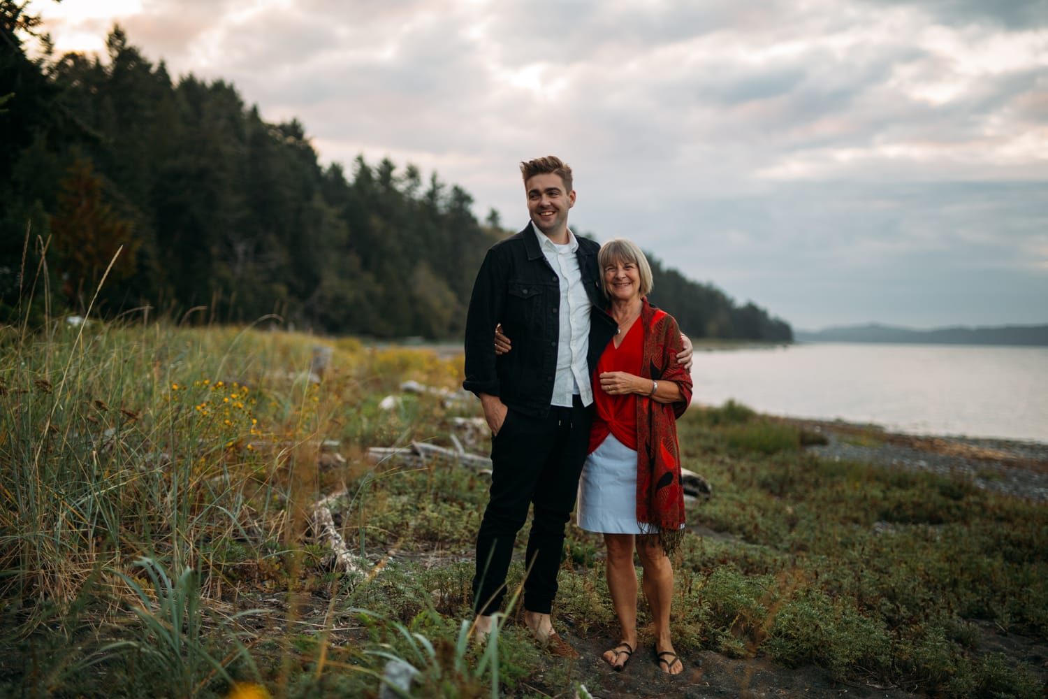 Mara and Casey weddings story frame 14: A Vancouver Island private-home wedding near Qualicum Beach, with Bowser prep, Friday gathering energy, custom vendors, kids, friends and cool Island air..