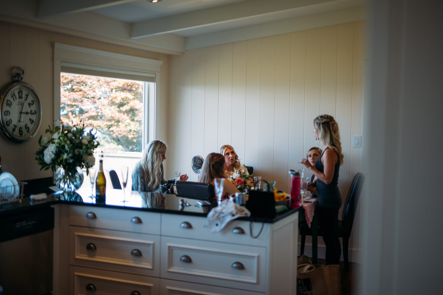 Mara and Casey weddings story frame 11: A Vancouver Island private-home wedding near Qualicum Beach, with Bowser prep, Friday gathering energy, custom vendors, kids, friends and cool Island air..