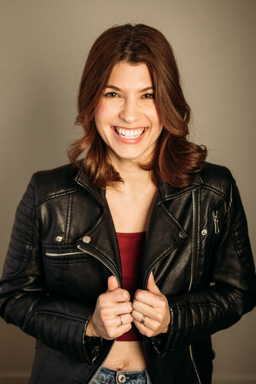 Marie at Clement portraits story frame 12: Actor and performer portraits on Clement Avenue in Kelowna, with red, black and leather wardrobe changes, slatted light and portfolio range for casting, promo and look-book use.