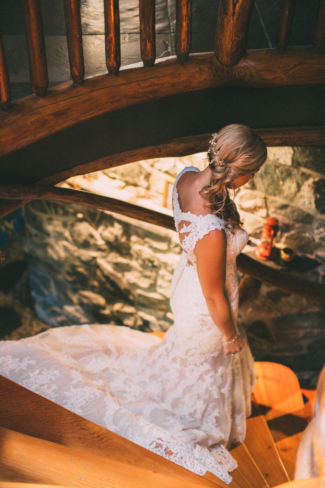 Megan and Jarid weddings story frame 3: A Shuswap-area wedding around Sicamous, Swansea Point and Hyde Mountain, with boat/lake context, cliff portraits and strong floral colour..