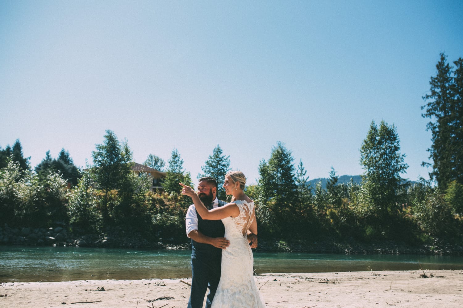 Megan and Jarid weddings story frame 6: A Shuswap-area wedding around Sicamous, Swansea Point and Hyde Mountain, with boat/lake context, cliff portraits and strong floral colour..