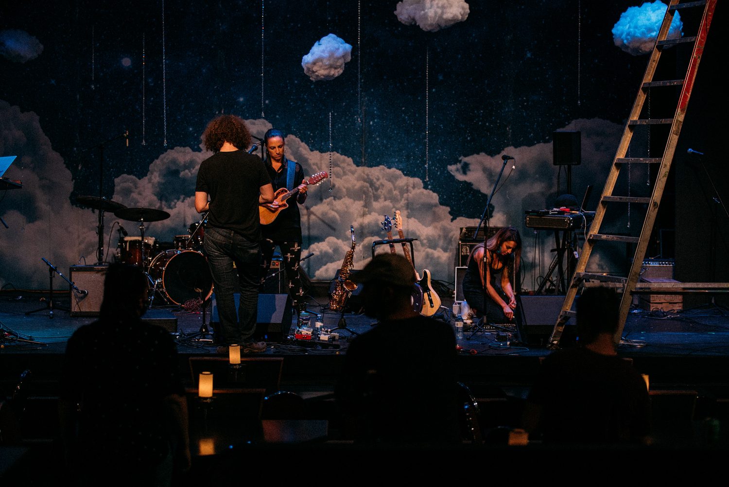 Close horizontal view of a performer singing into the microphone.