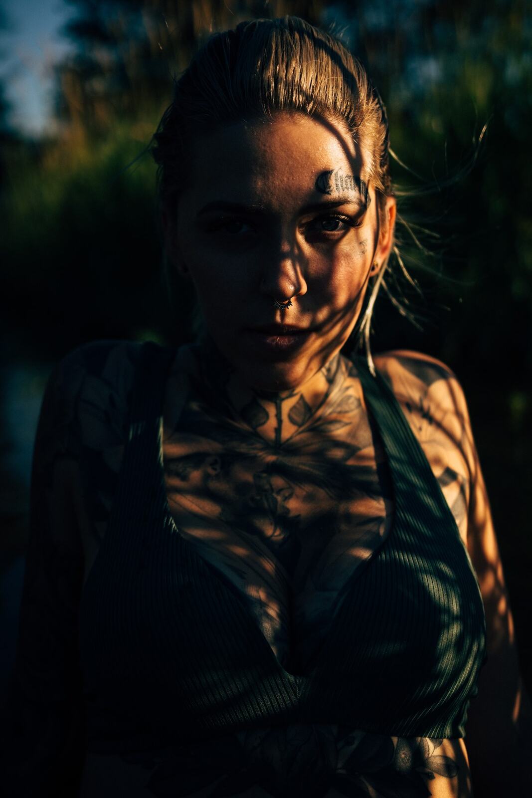 Rayleigh by Knox portraits story frame 10: Knox Mountain portraits in Kelowna with white floral dress, tattoo detail, reeds, water, sunlight and a stronger summer edge.
