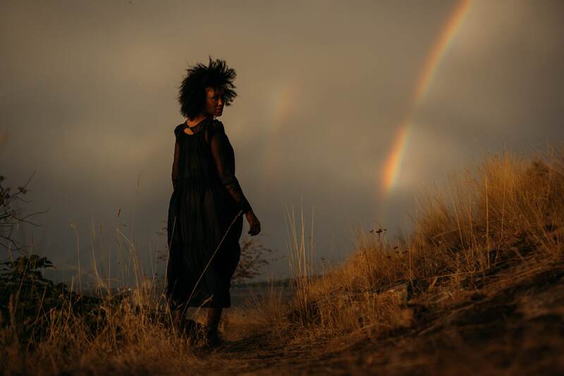 Rebekah at Bertram portraits story frame 12: A Bertram portrait story moving from floral dress and lake light into black dress, white shirt, sunset and water silhouettes.